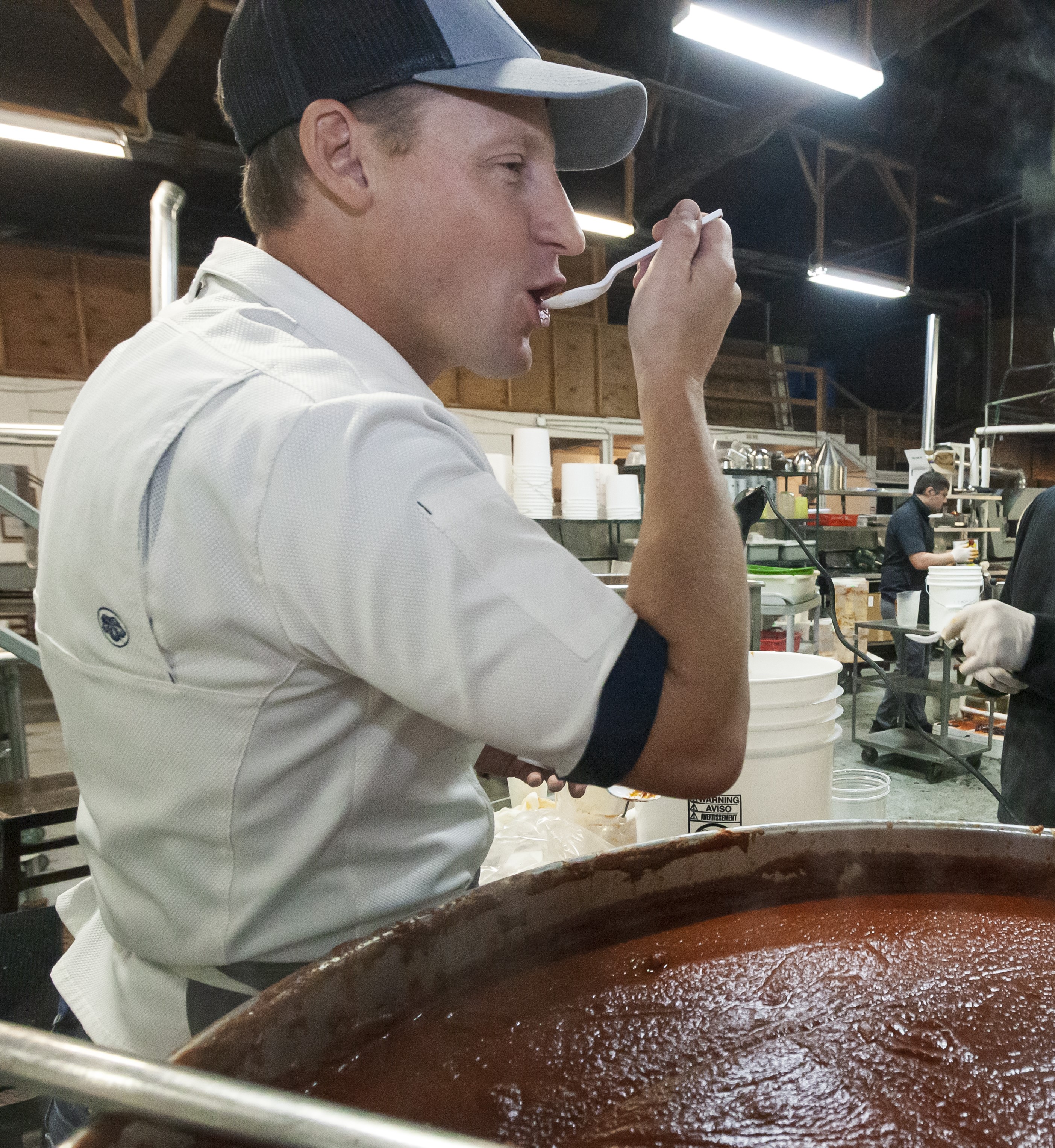 Chef Dave tasting his Dos Haches Chili Sauce